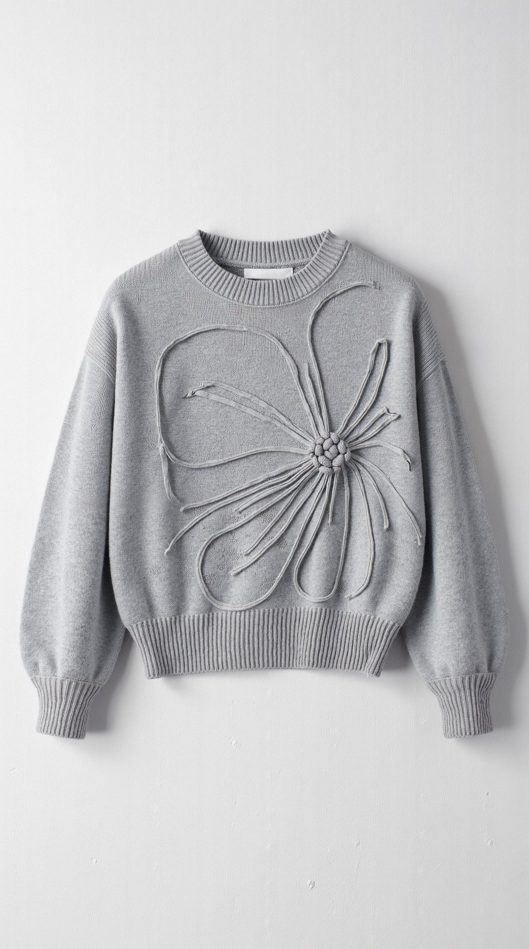 Knitted sweater with floral design