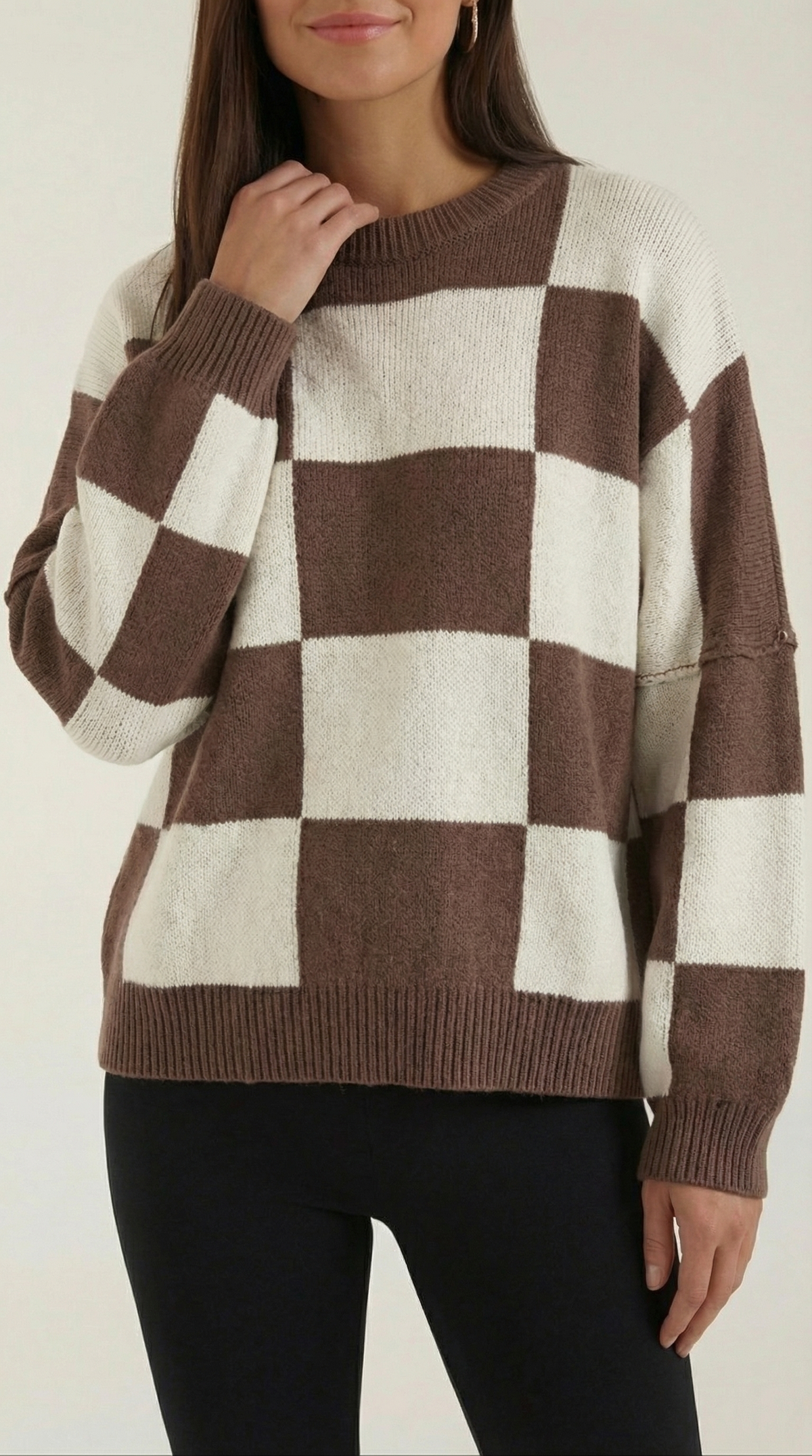 Knitted sweater with a plaid design