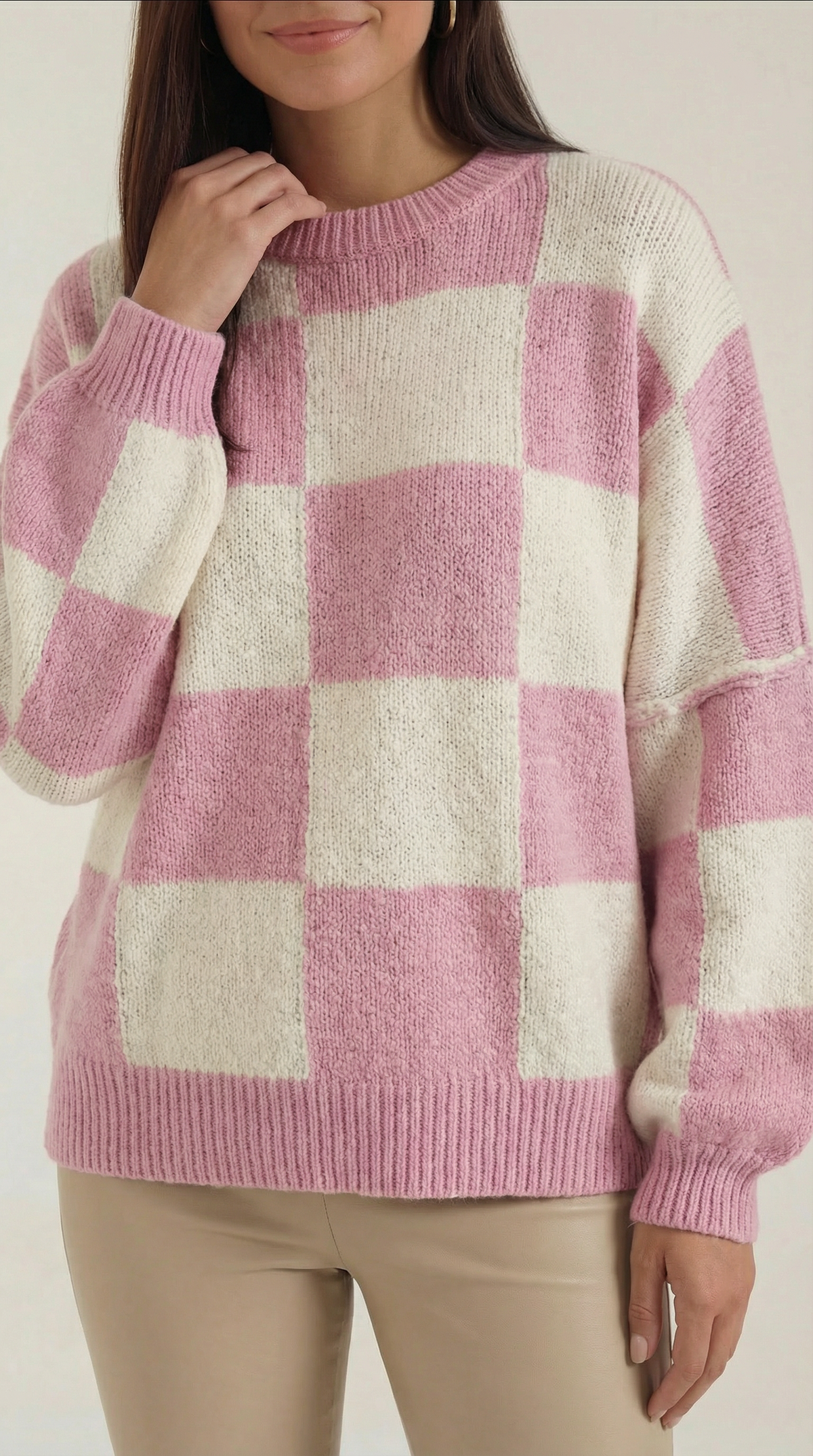 Knitted sweater with a plaid design
