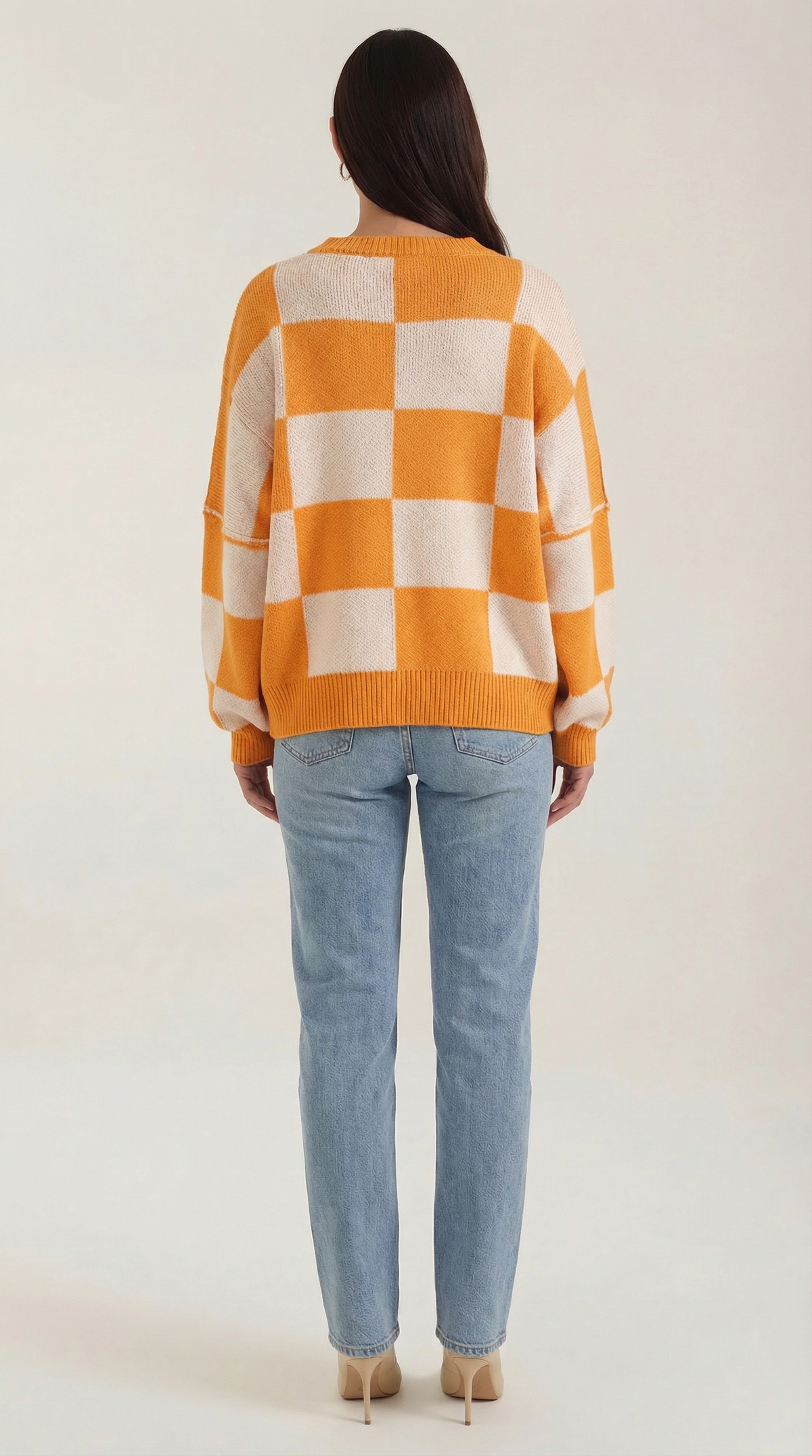 Knitted sweater with a plaid design