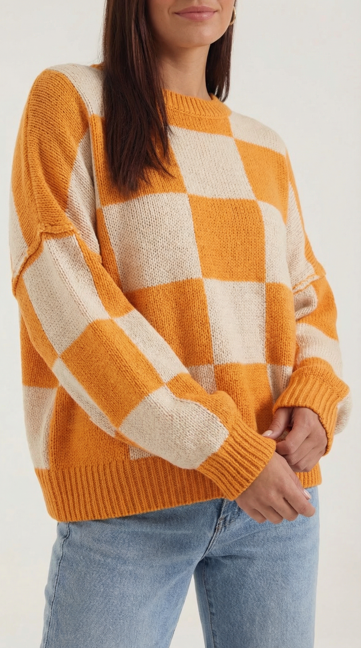 Knitted sweater with a plaid design