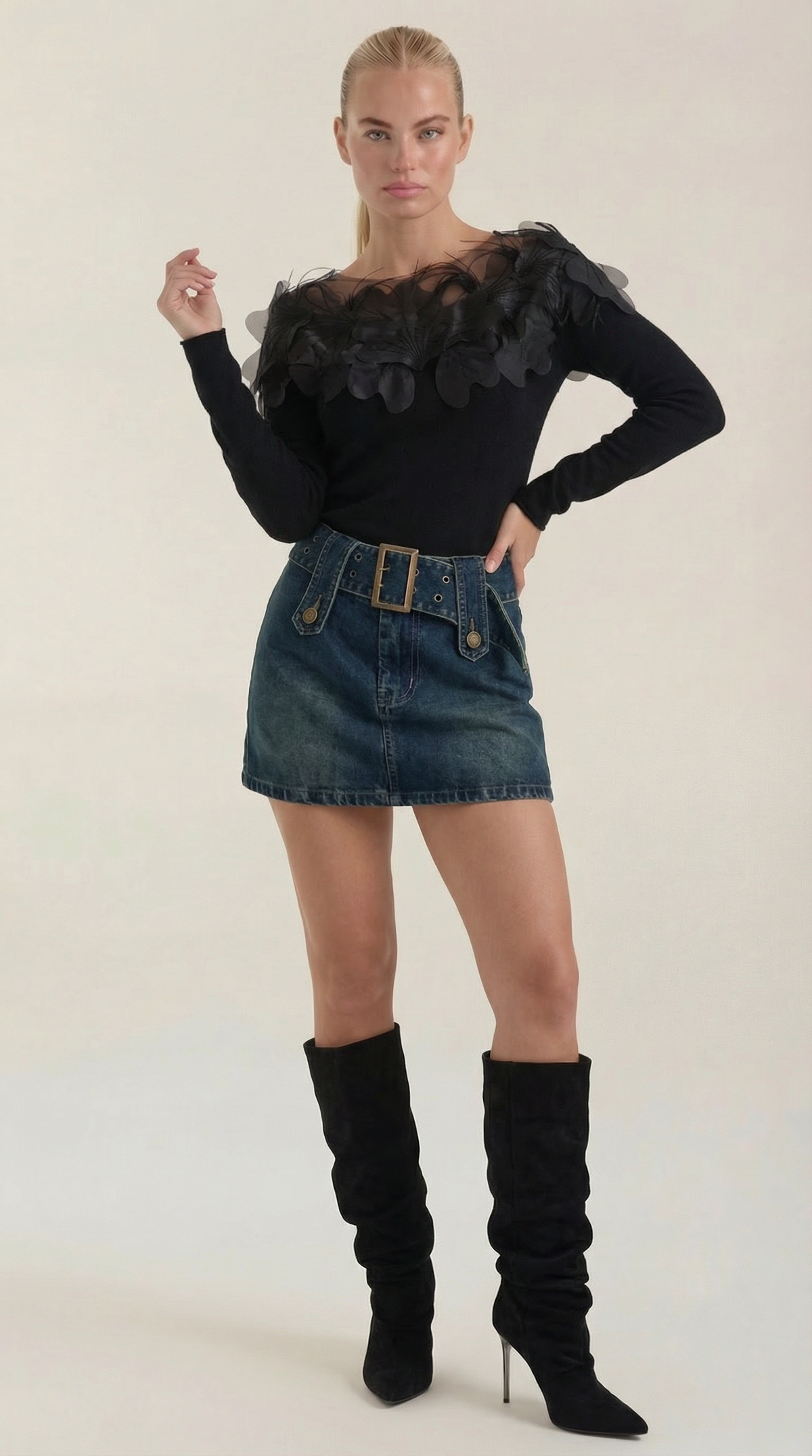 Knitted sweater with feather embellishments