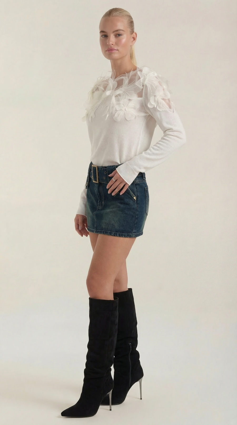 Knitted sweater with feather embellishments