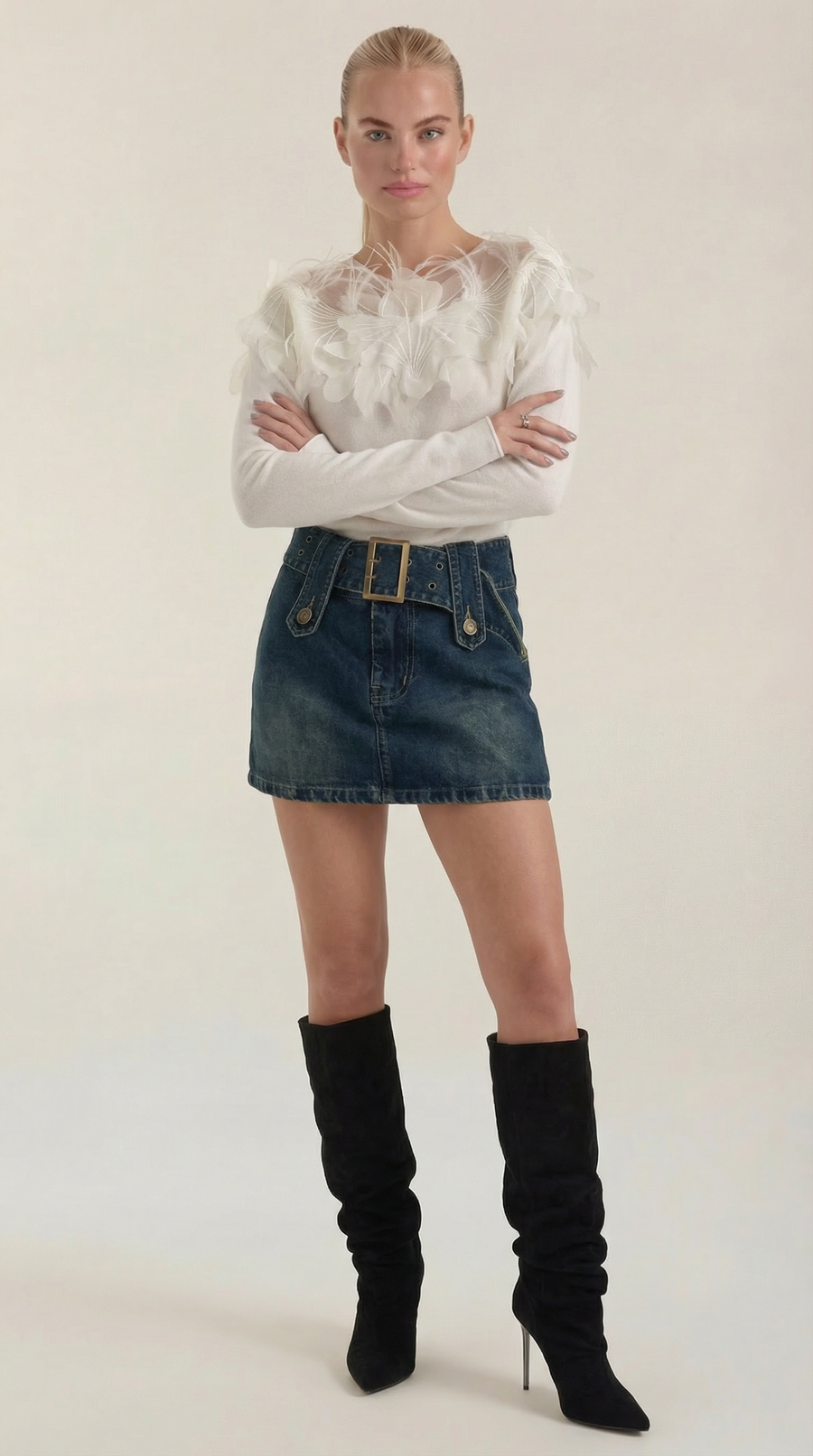 Knitted sweater with feather embellishments